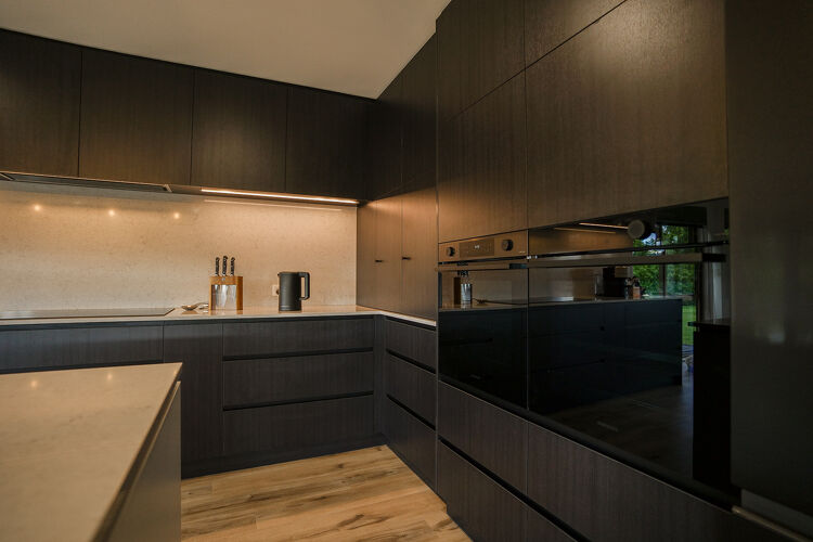 Modern dark themed kitchen.